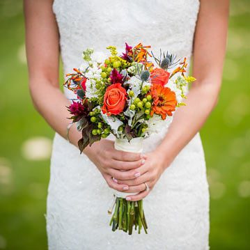 Vintage VW Campervan Weddings the bride with her bouquet of wild flowers